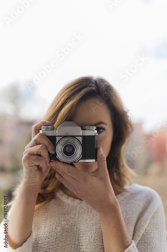 girl taking a picture of the viewer