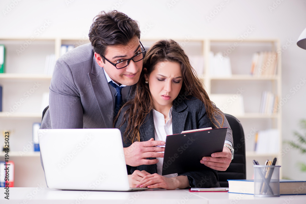 Sexual harassment concept with man and woman in office Sexual harassment concept with man and woman in office
