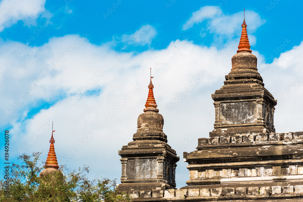 Naklejka premium Pagodas in the temple Thatbyinnyu in Bagan, Myanmar. Copy space for text.