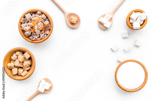 Sugar types. Cane, refind, granulated, cubes, candy sugar. White background top view copy space