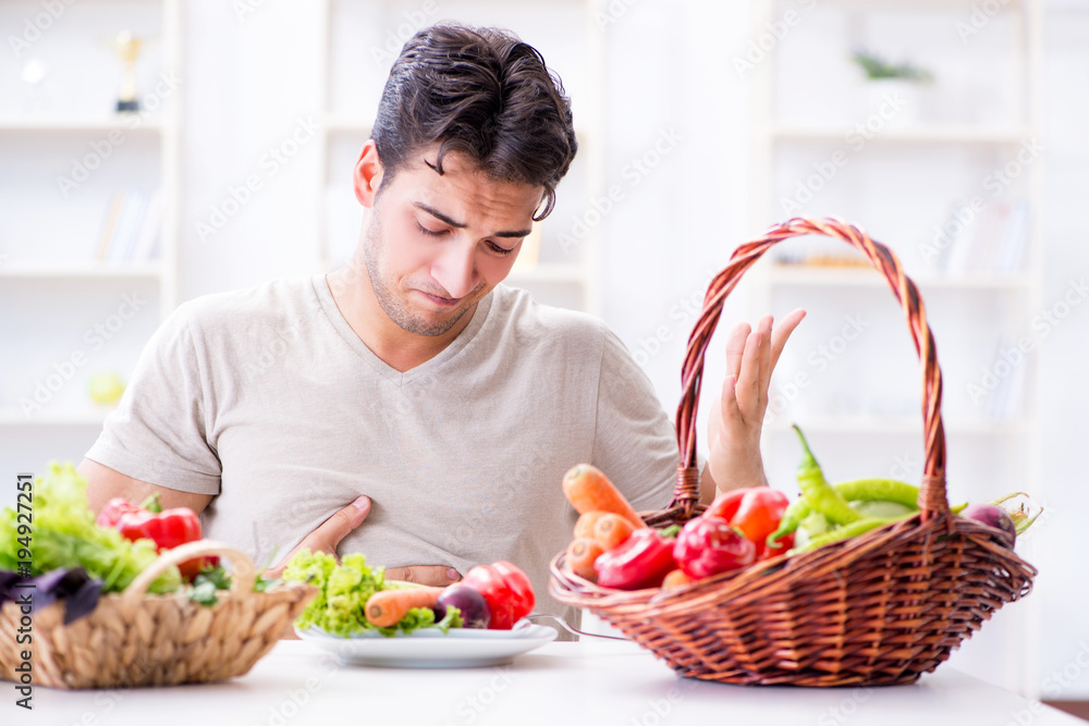 Young man in healthy eating and dieting concept Young man in healthy eating and dieting concept