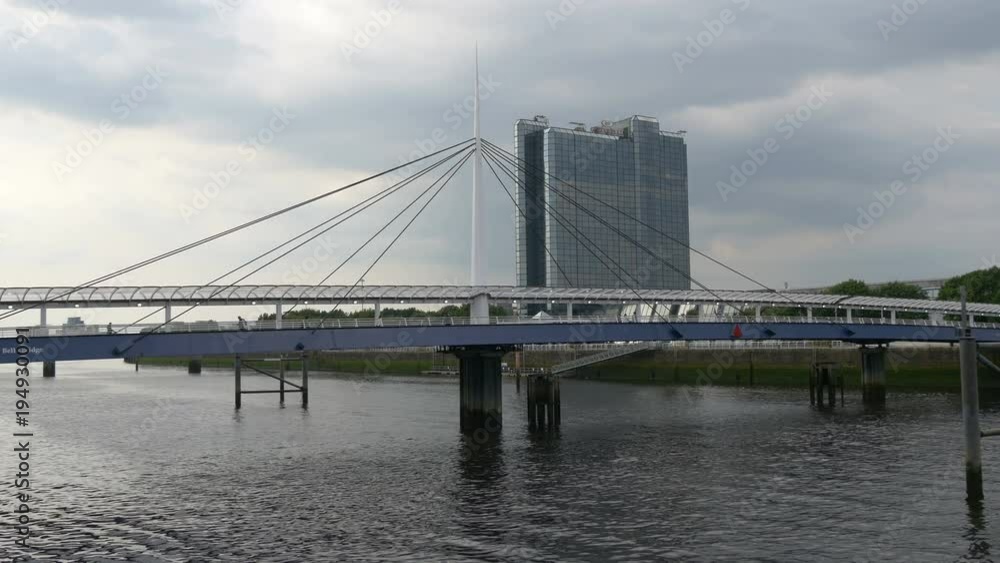 Clouds over a bridge and a modern building Clouds over a bridge and a modern building