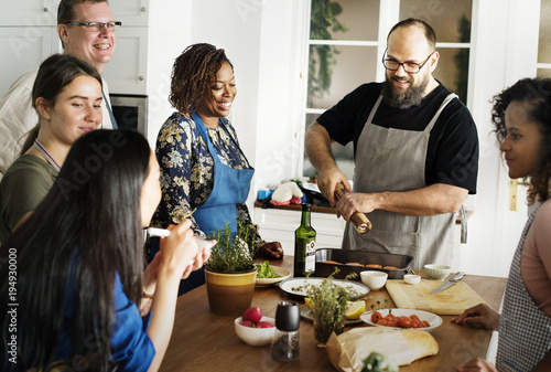 Diverse people joining cooking class photo