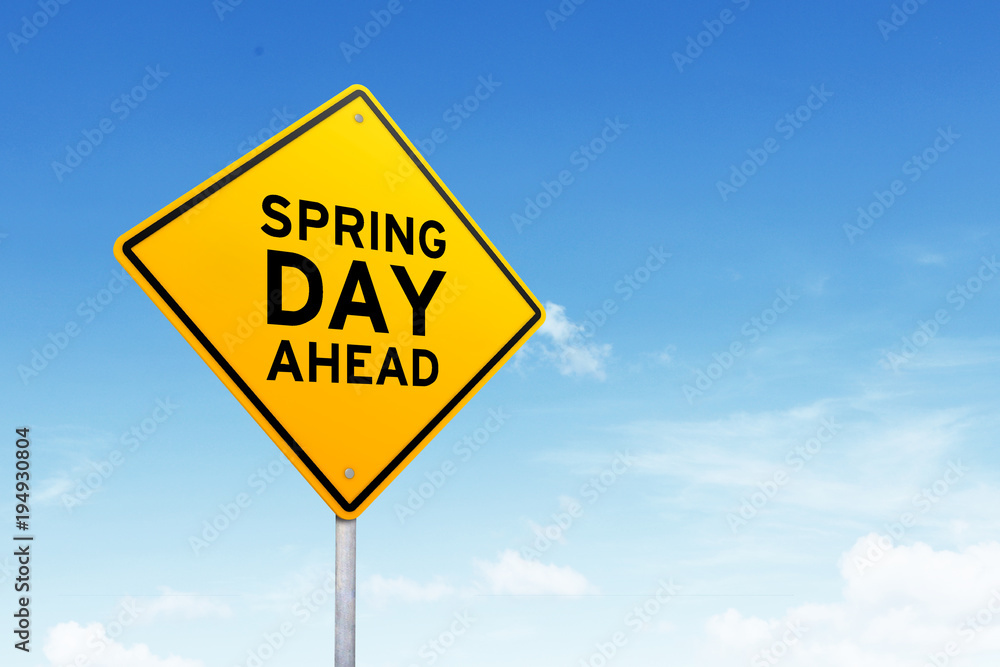 Spring is coming road sign shot over beautiful blue sky. Spring is coming road sign shot over beautiful blue sky.