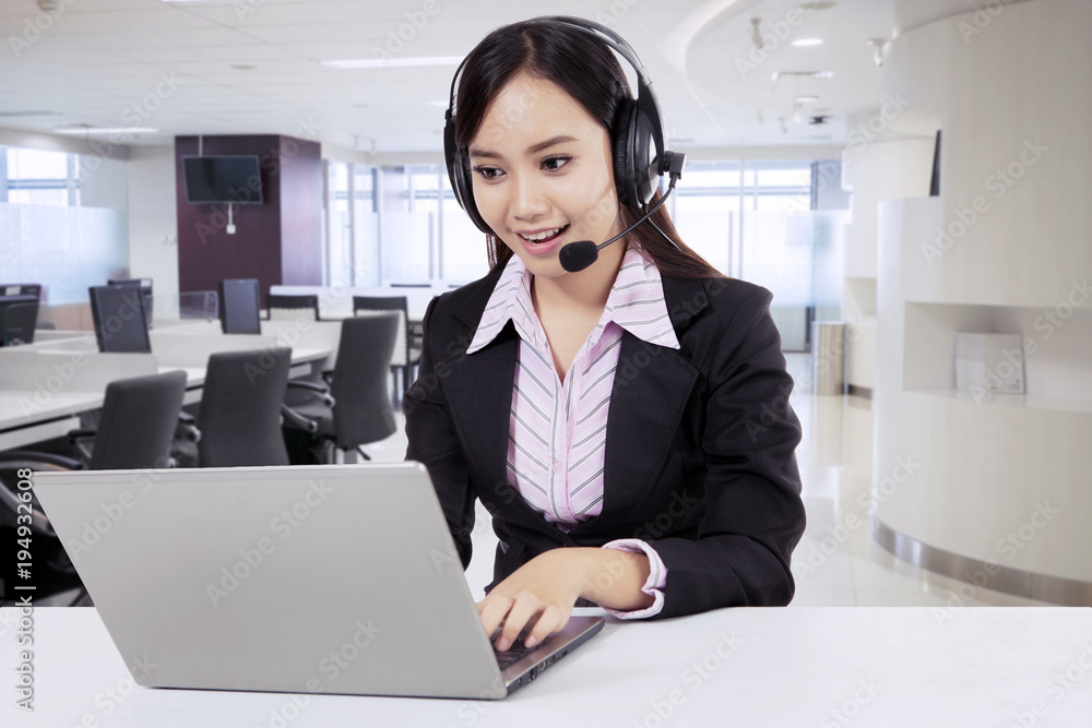 Friendly asian customer service with headset Friendly asian customer service with headset