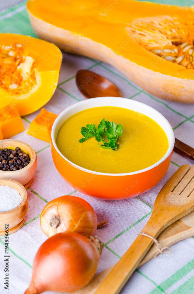 Pumpkin soup served on the table in bowl Pumpkin soup served on the table in bowl