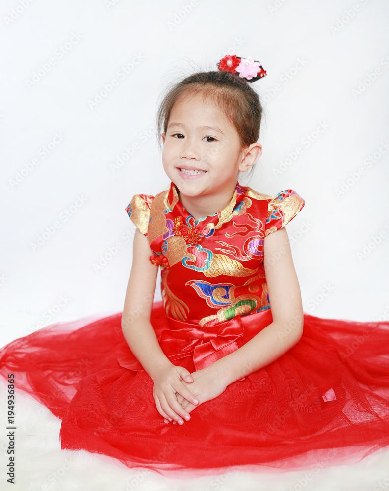Portrait face of little asian girl in cheongsam on traditional chinese new year festival. Portrait face of little asian girl in cheongsam on traditional chinese new year festival.
