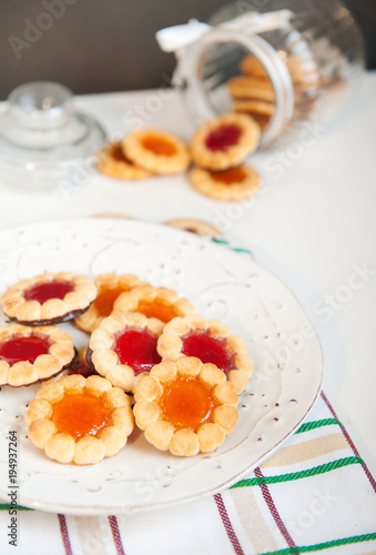 Cookies with jam in a glass jar 