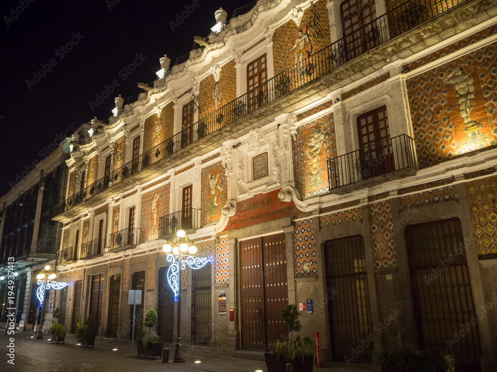 Fototapeta premium Puebla, Mexico, South America - January 2018: [Town of Puebla at night, street and church decorated with lights]