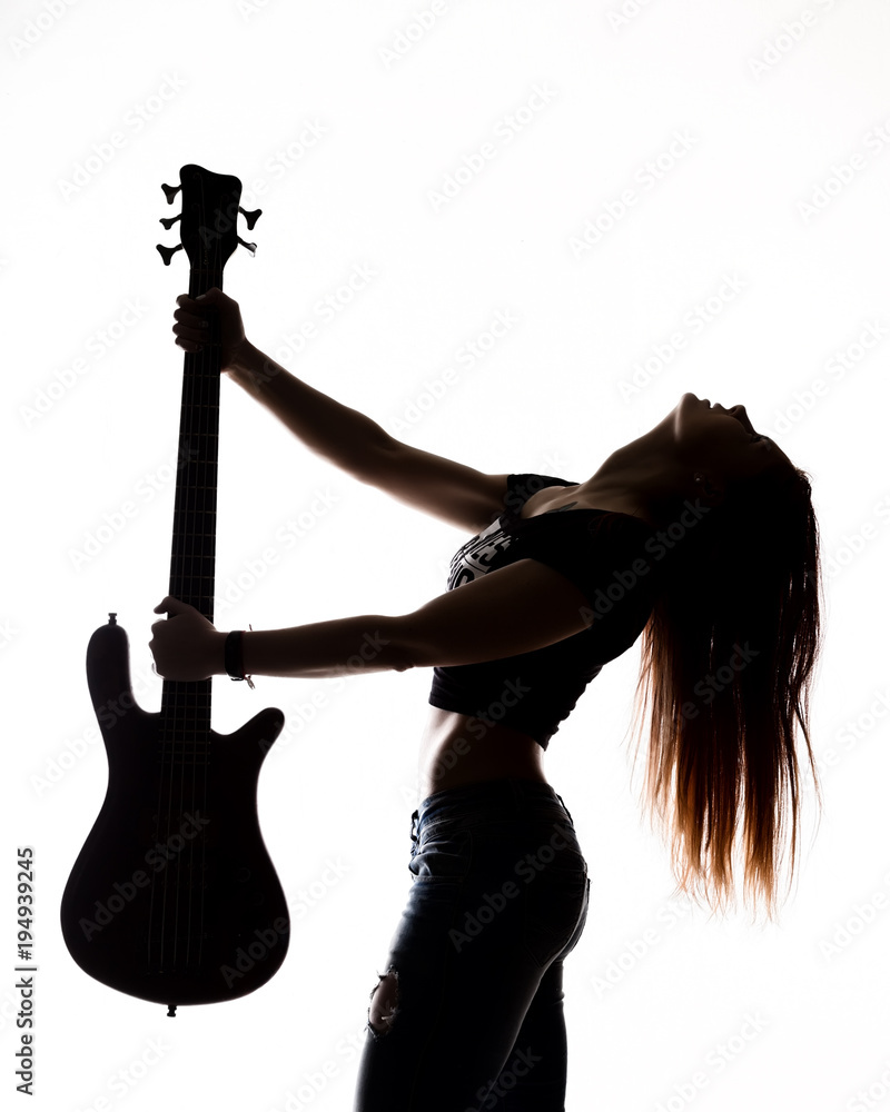 Obraz premium silhouette of rock woman playing on electric guitar on a white background.