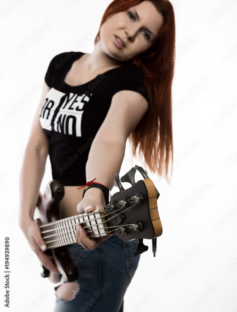rock woman playing on electric guitar on a white background. rock woman playing on electric guitar on a white background.