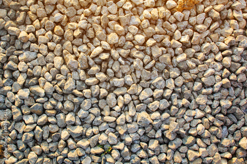 ground stones pattern with warm sun light and shadow for background
