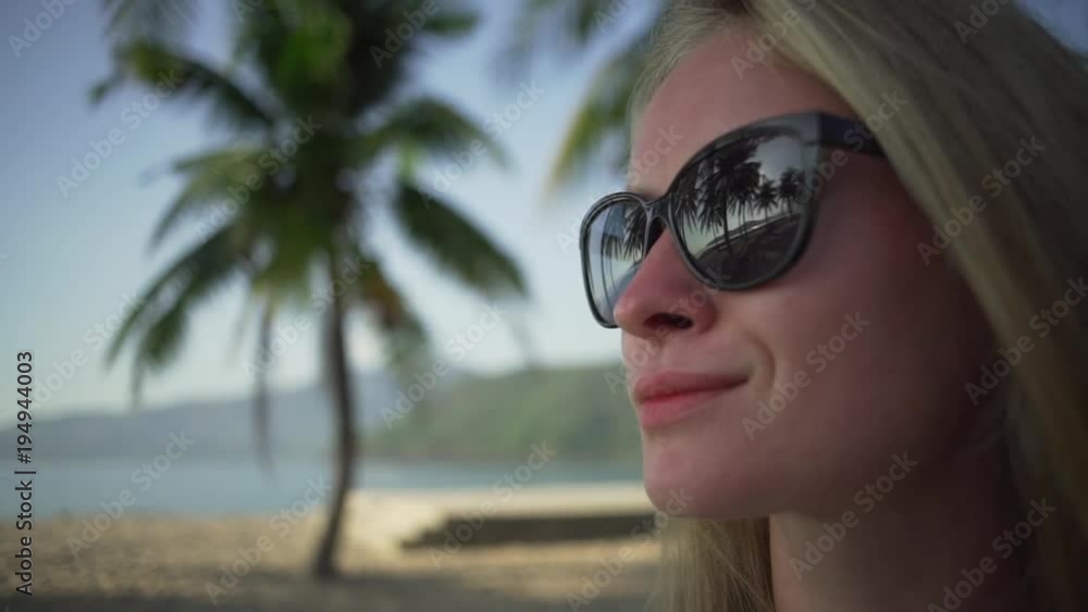 Close up girl face in sunglasses with resort reflection rapid slow motion Close up girl face in sunglasses with resort reflection rapid slow motion