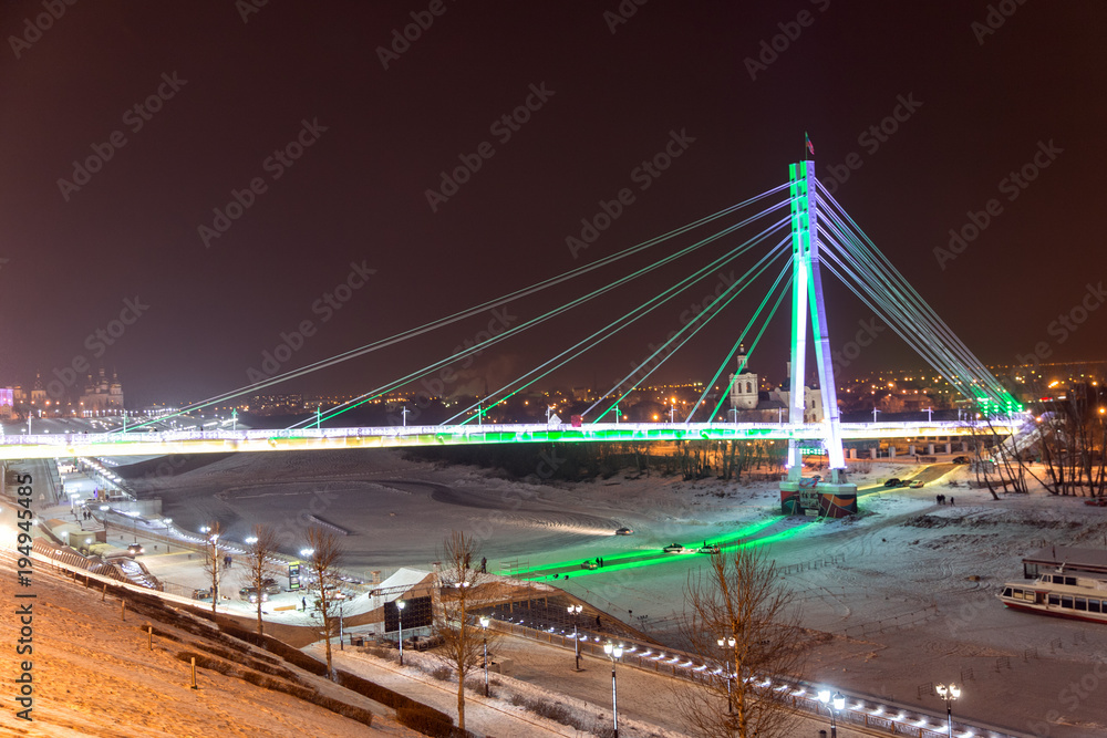Bridge of lovers with night illumination. The city of Tyumen. Russia
