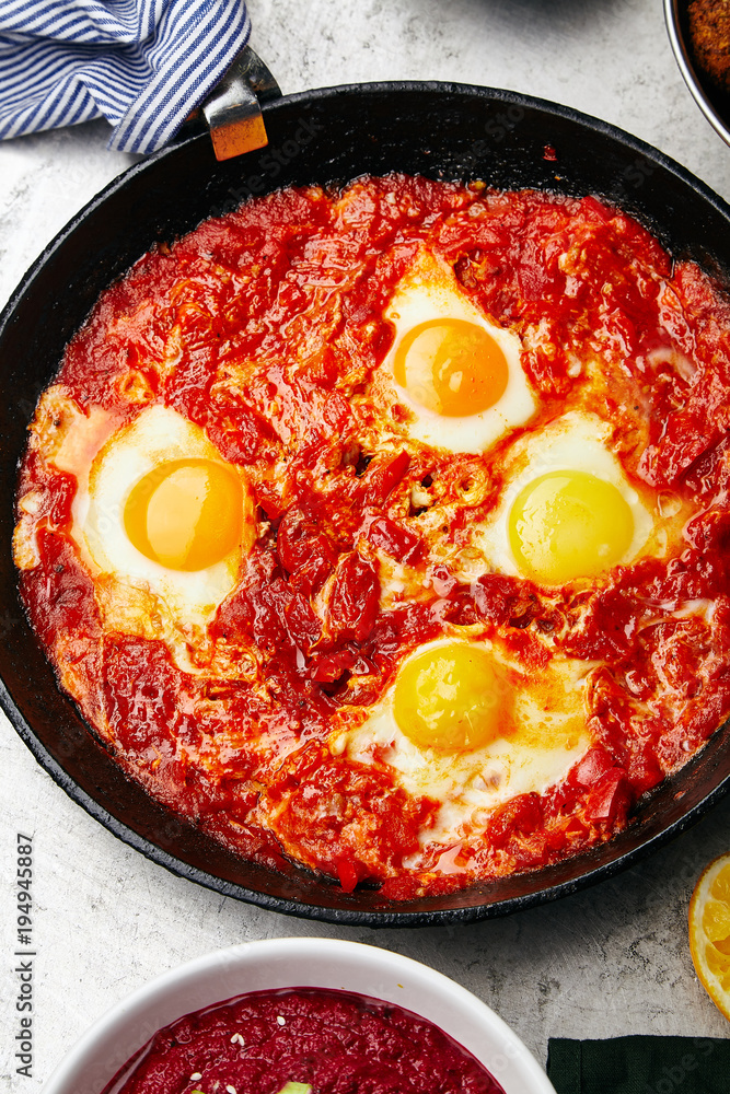 Overhead image of traditional jewish and middle eastern food: shakshuka. Israeli cuisine concept Overhead image of traditional jewish and middle eastern food: shakshuka. Israeli cuisine concept