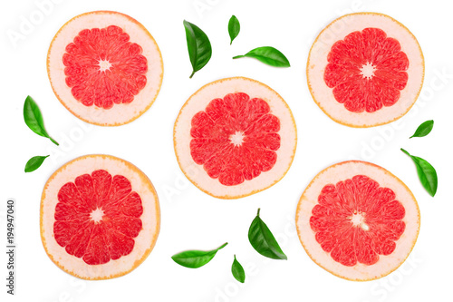 Grapefruit slices with leaf isolated on white background. Top view. Flat lay pattern