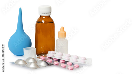 Bottles with medicine, nasal spray. Cough syrup, antipyretic syrup and nose drops on white background. Medication for cold treatment, copy space, template