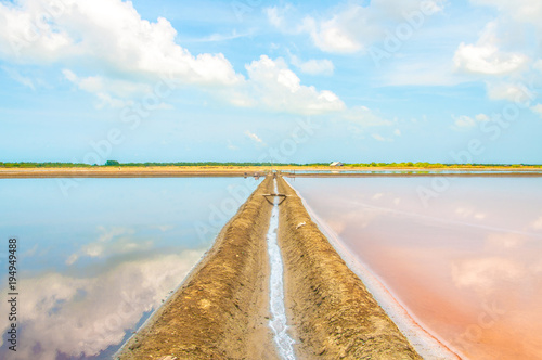Salt evaporation ponds, also called salterns or salt pans located at Phetchaburi, Thailand photo