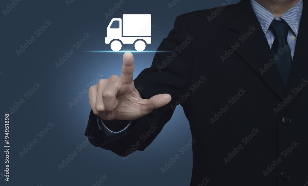 Businessman pressing truck delivery icon over gradient light blue background, Business transportation service concept Businessman pressing truck delivery icon over gradient light blue background, Business transportation service concept