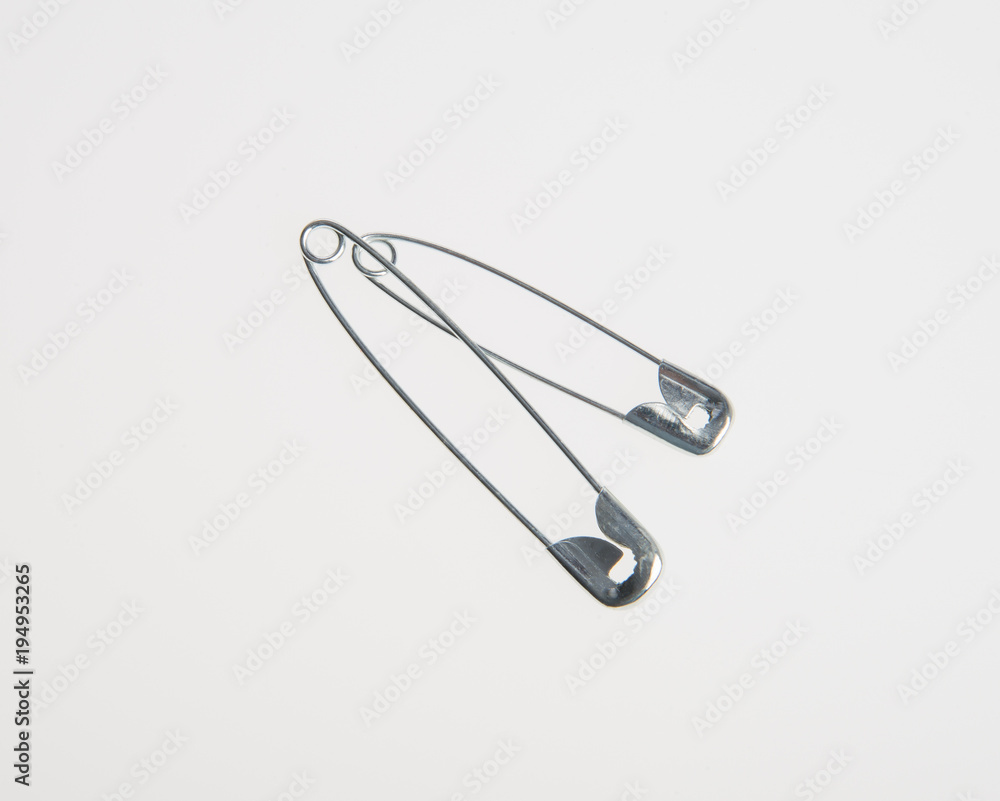 Pin or sewing safety pin on a background. Pin or sewing safety pin on a background.