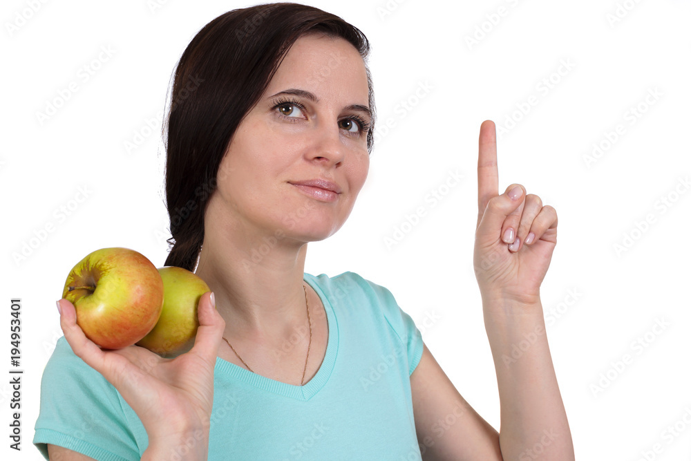 The girl in hands has apples and a finger up The girl in hands has apples and a finger up