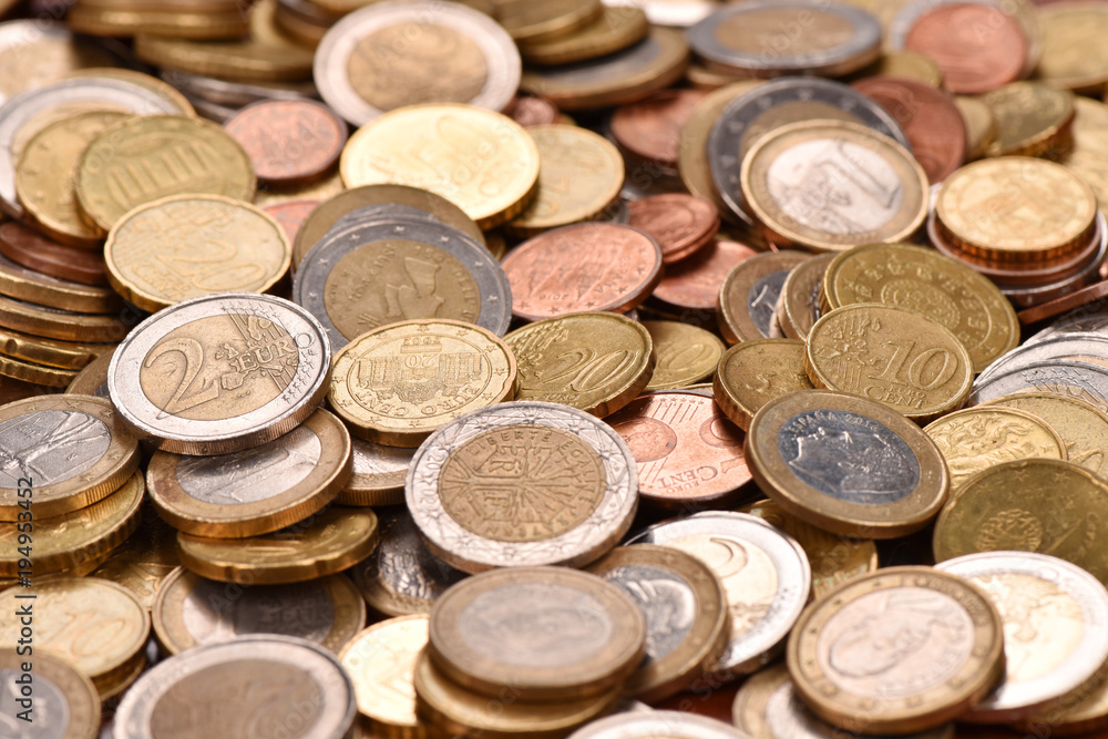 Euro coins scattered on the table. Good earnings. Financial flows. Euro coins scattered on the table. Good earnings. Financial flows.