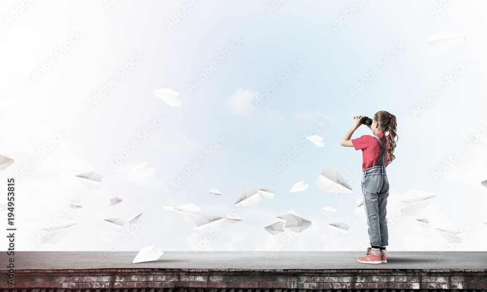 Concept of careless happy childhood with girl of school age look