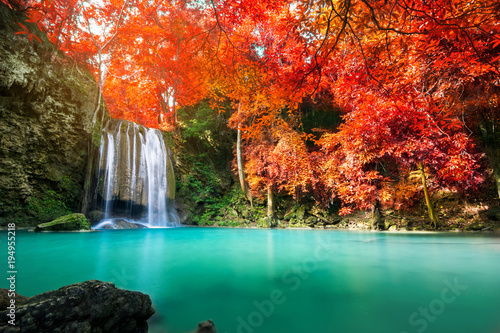 Amazing waterfall in colorful autumn forest 