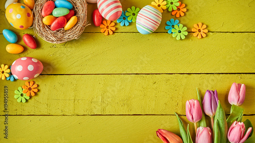 Colorful Easter still life with eggs and flowers photo