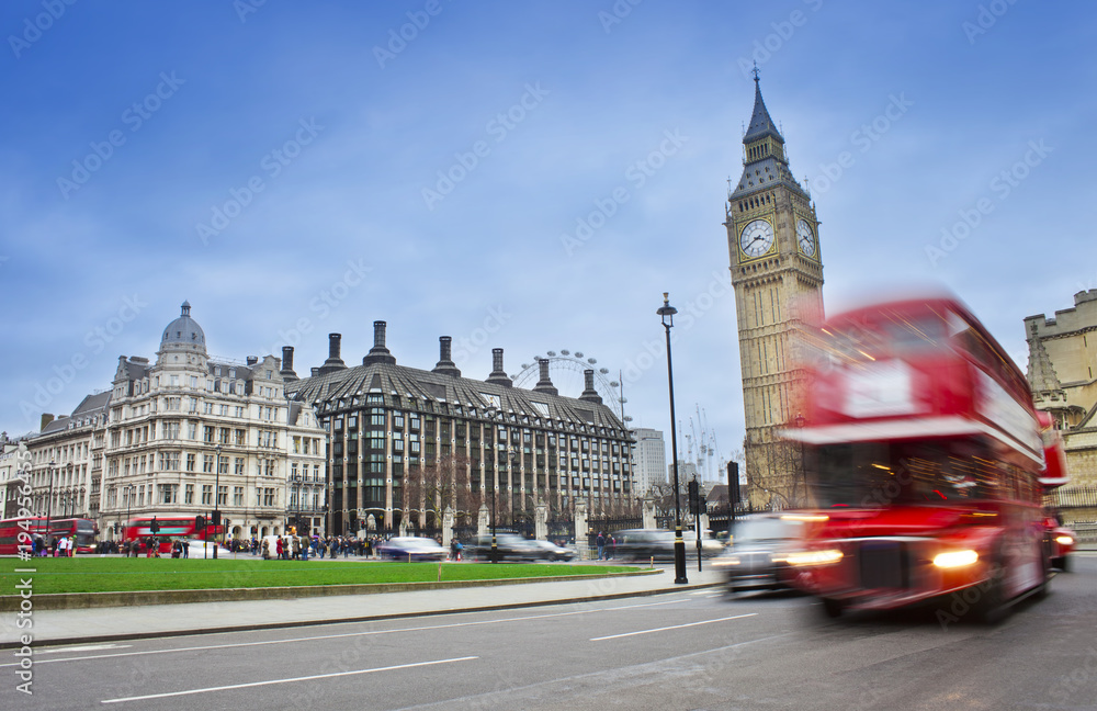 London city scene with red bus and Big Ben in background. Long exposure photo