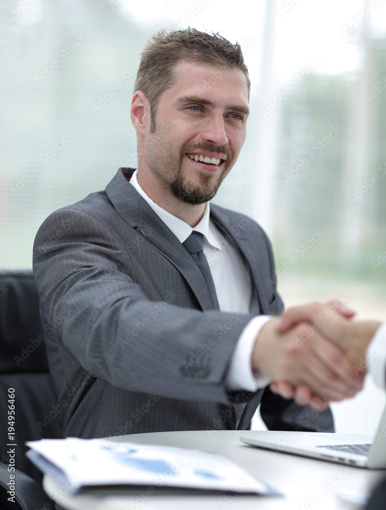 closeup .handshake of business partners above the Desk closeup .handshake of business partners above the Desk
