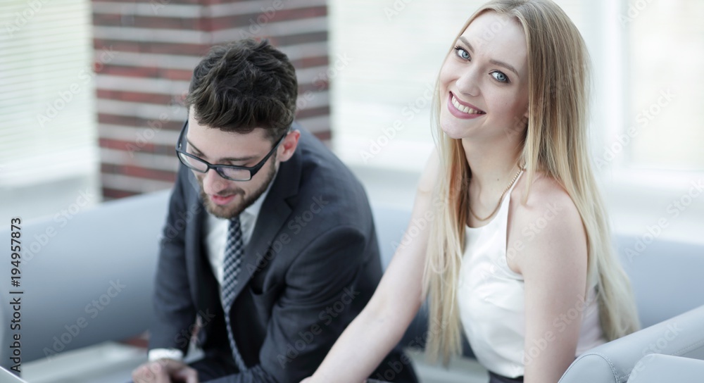 manager and client browsing information on the laptop. manager and client browsing information on the laptop.
