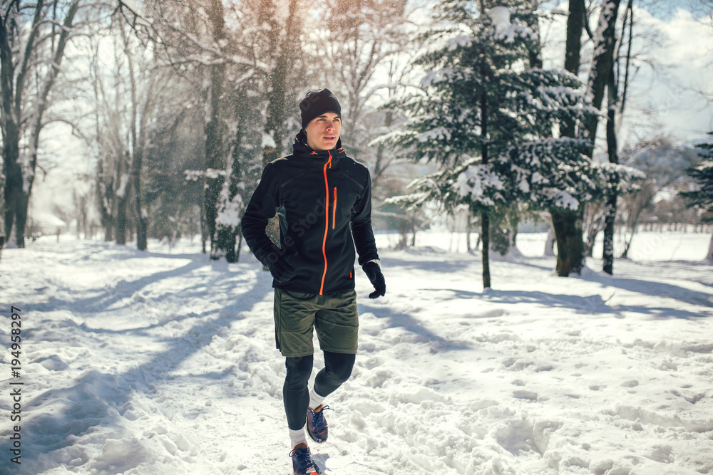 Man Sportsman Taking Break From Running in Extreme Snow Conditions