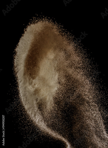 Sand explosion isolated on over dark background,Abstract sand cloud,Motion blur