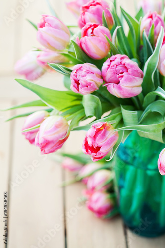 Fototapeta Naklejka Na Ścianę i Meble -  Bouquet of beautiful pink tulips in vase
