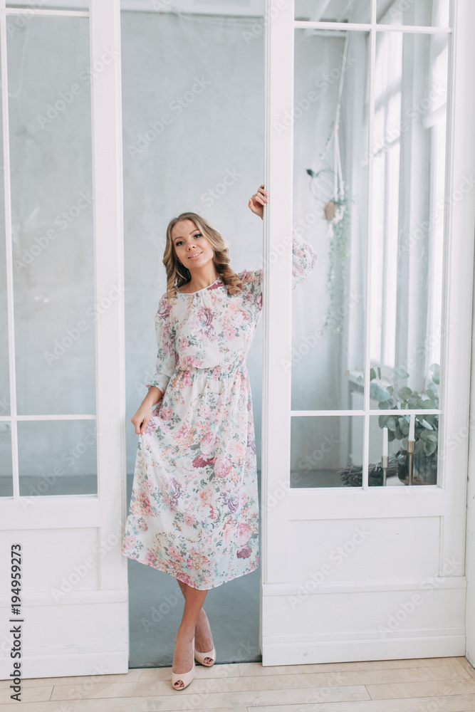 beautiful young blonde woman in nice spring dress, elegant black sunglasses posing in a studio. Fashion spring summer photo beautiful young blonde woman in nice spring dress, elegant black sunglasses posing in a studio. Fashion spring summer photo