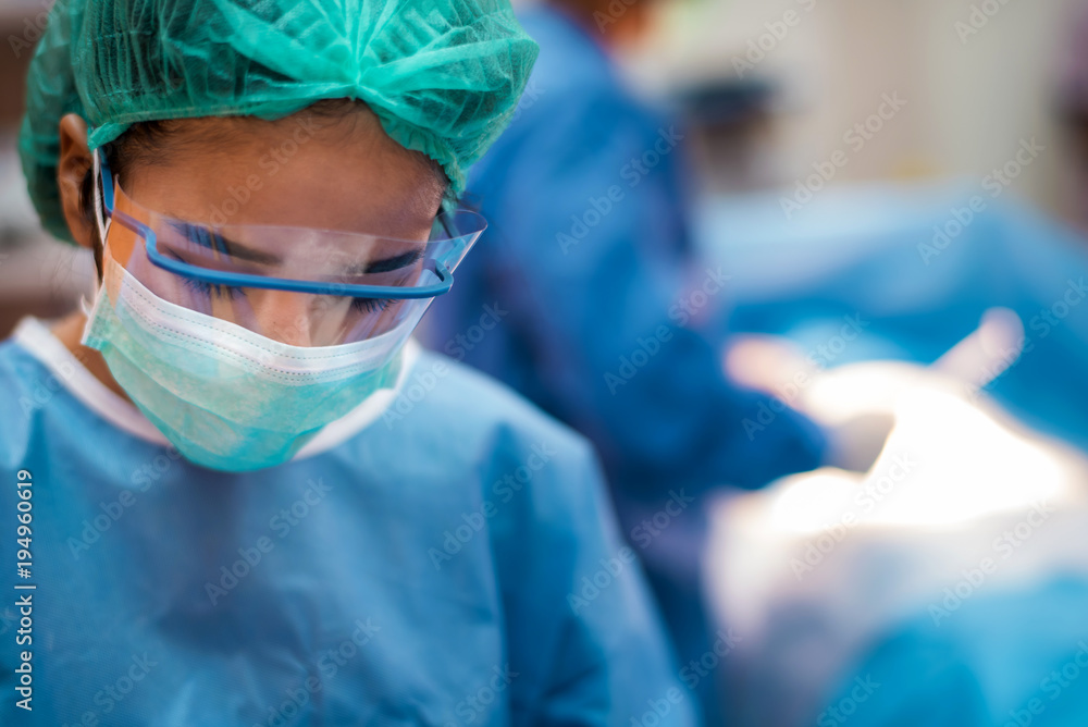 team of surgeons working in the operating room, medical concept team of surgeons working in the operating room, medical concept