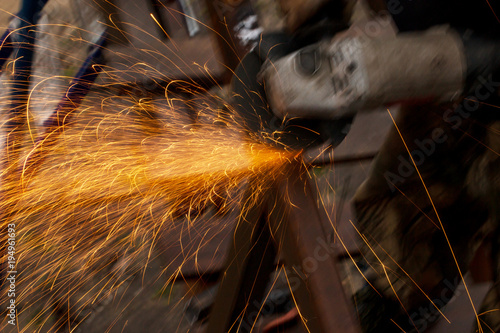 hands at work with metal welding