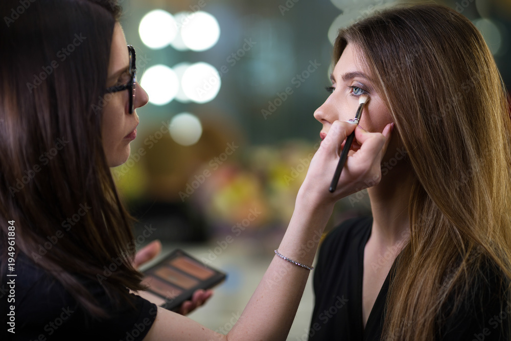 Professional makeup artist working with beautiful young woman. Fashionable Female Model With Soft Skin, Perfect Makeup And Fake Eyelashes. High Resolution
Professional makeup artist working with beautiful young woman. Fashionable Female Model With Soft Skin, Perfect Makeup And Fake Eyelashes. High Resolution
