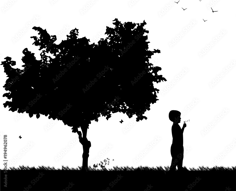 Boy blowing the dandelion in park under the tree silhouette, one in the series of similar images Boy blowing the dandelion in park under the tree silhouette, one in the series of similar images