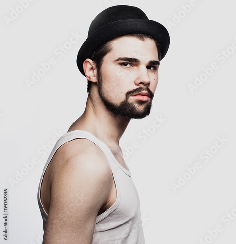 Young bearded man over white background