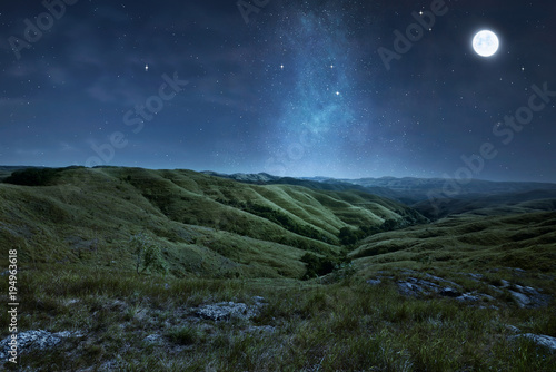 Scenery of green hills with stars photo