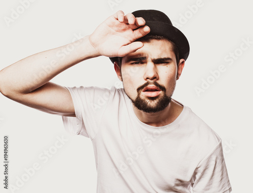 Portrait of surprised bearded man  against white  background