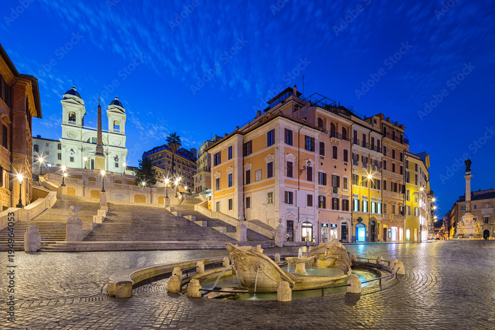 Night view of Spanish Steps and  Fontana della Barcaccia in Rome, Italy.