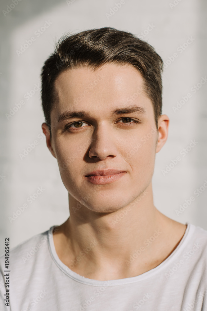 portrait of handsome man looking at camera at home portrait of handsome man looking at camera at home
