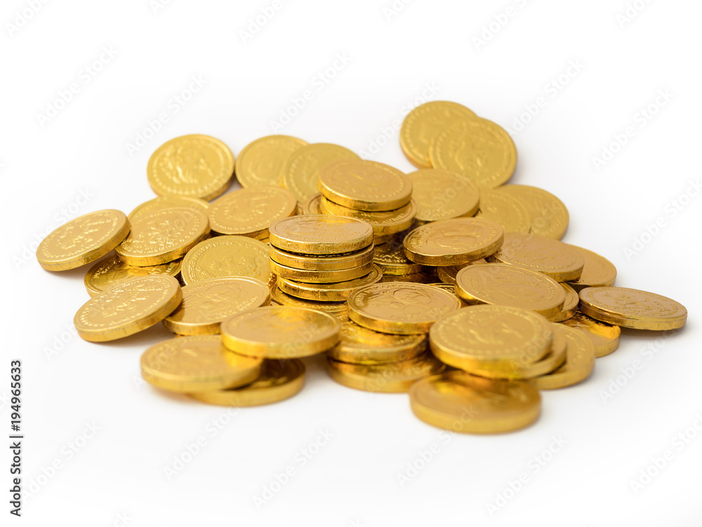 close up a pile of golden coins isolated on white background close up a pile of golden coins isolated on white background