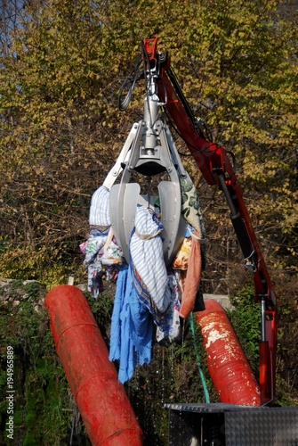 Machinery transferring clothes to water-washing cylinders at the village Kefalovryso in Elassona county, Thessaly region, central Greece. photo