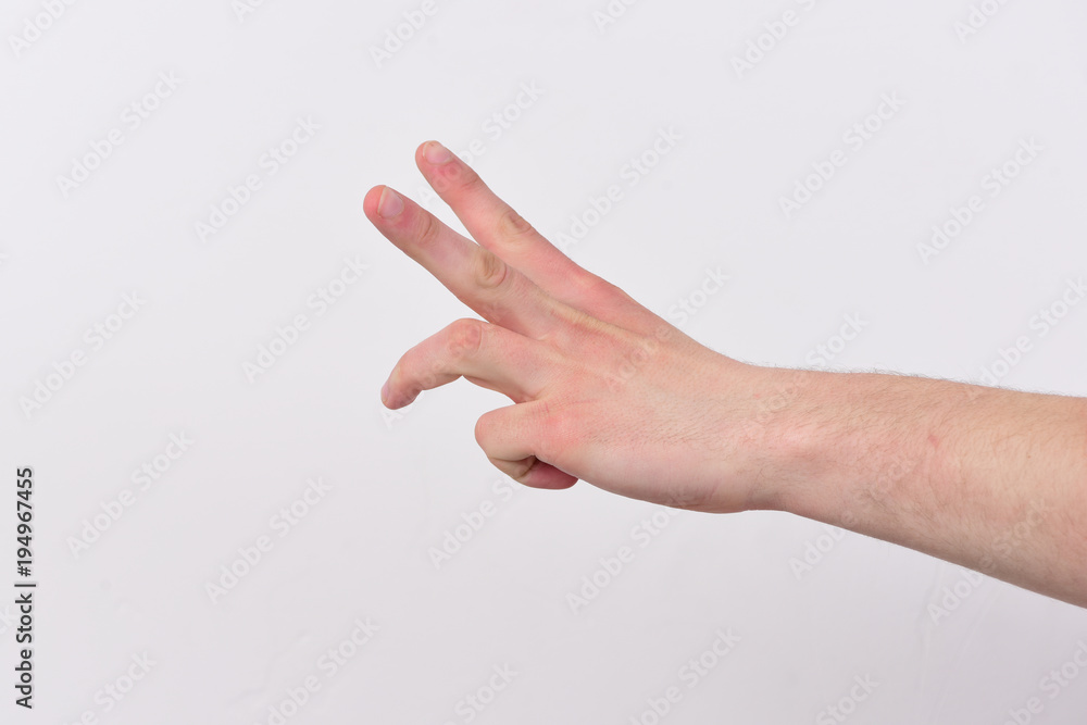 Male hand shows two and half of finger. Count down Male hand shows two and half of finger. Count down