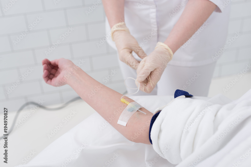 partial view of woman with drop counter and doctor near by partial view of woman with drop counter and doctor near by