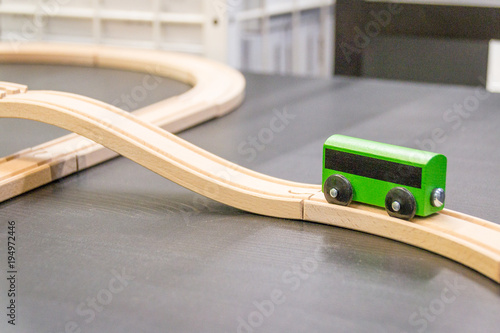 Green bus. Wooden viaduct, ring. Child's toy. photo